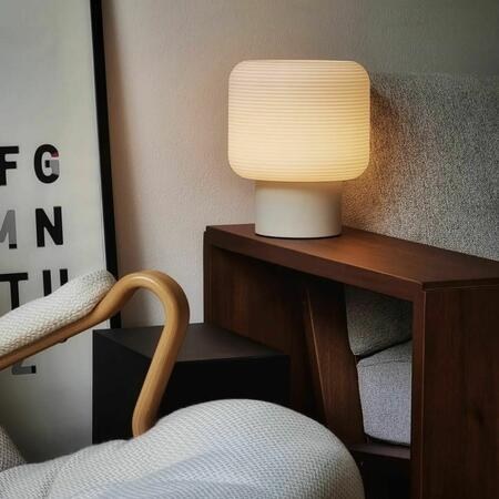 Gantri table lamp on a wood shelf