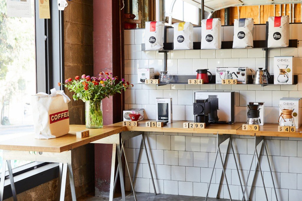 Coffee bags and brew gear inside Linea's cafe