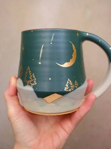 Sven mug with a gold moon and trees design